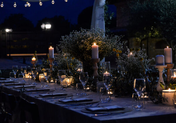 Candlelit outdoor fundraiser gala dinner table setting at night — full-service catering in the Bay Area