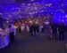 Guests mingling at an evening corporate holiday party in the Bay Area